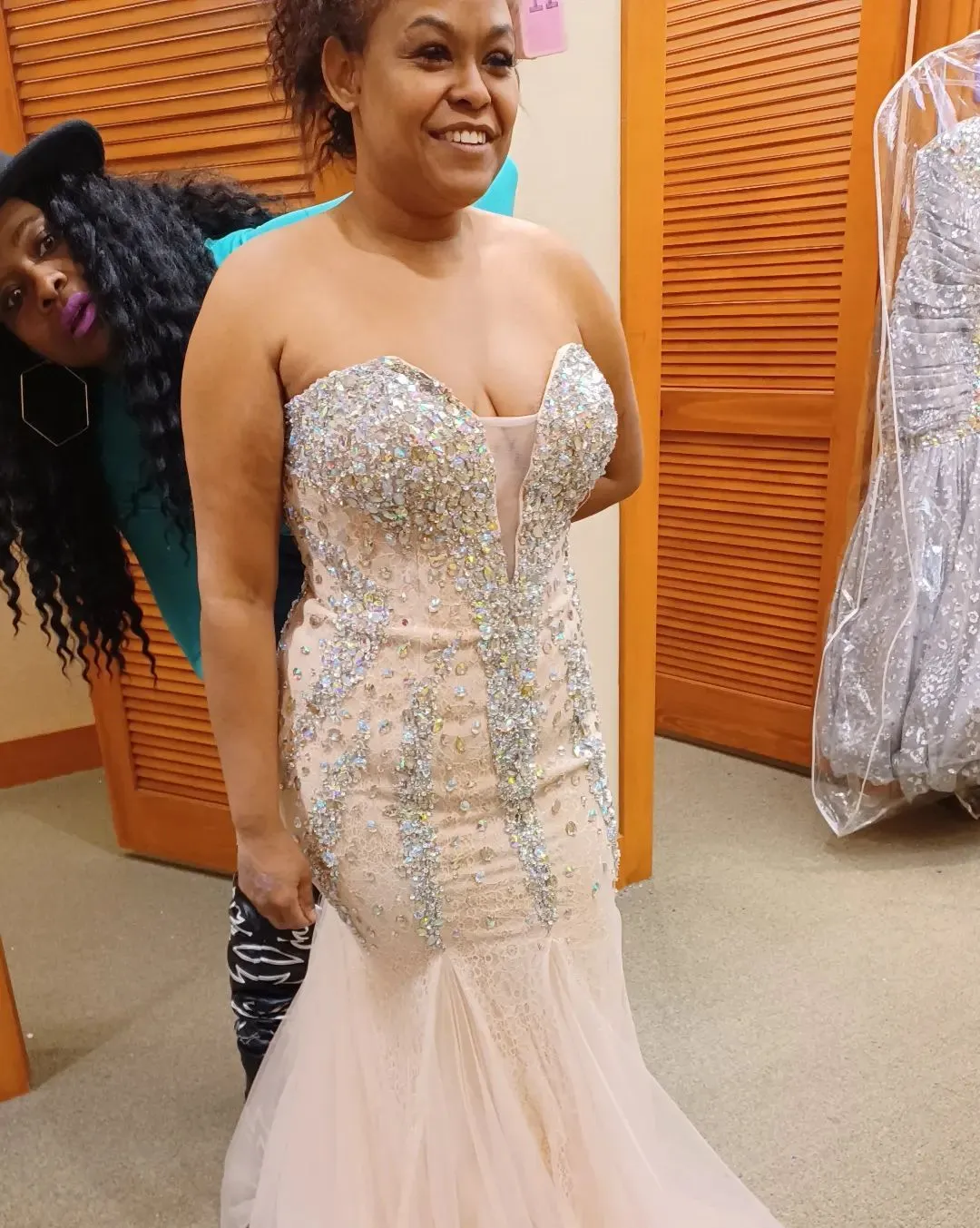 Crystal-embellished mermaid gown during a tailored fitting
