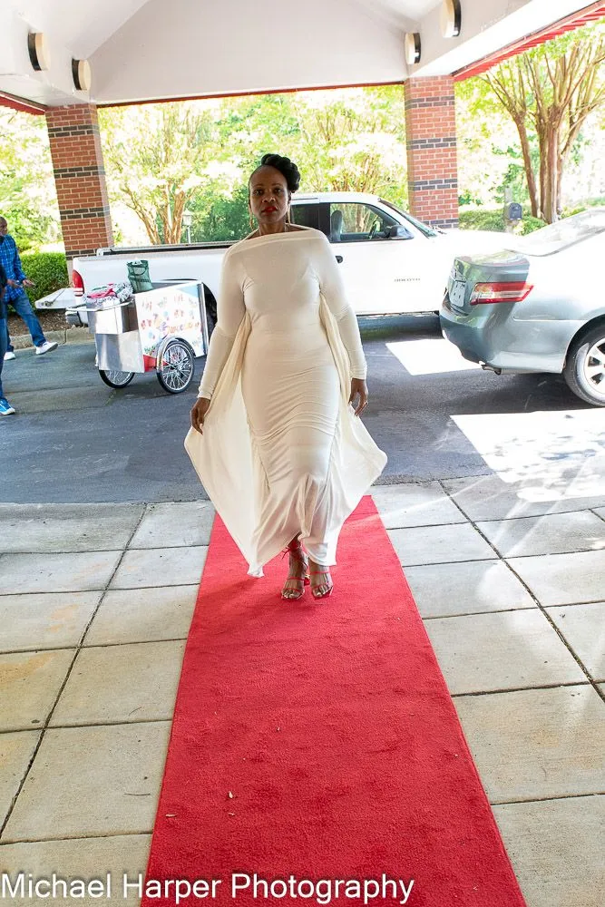 White gown styled for a red-carpet arrival
